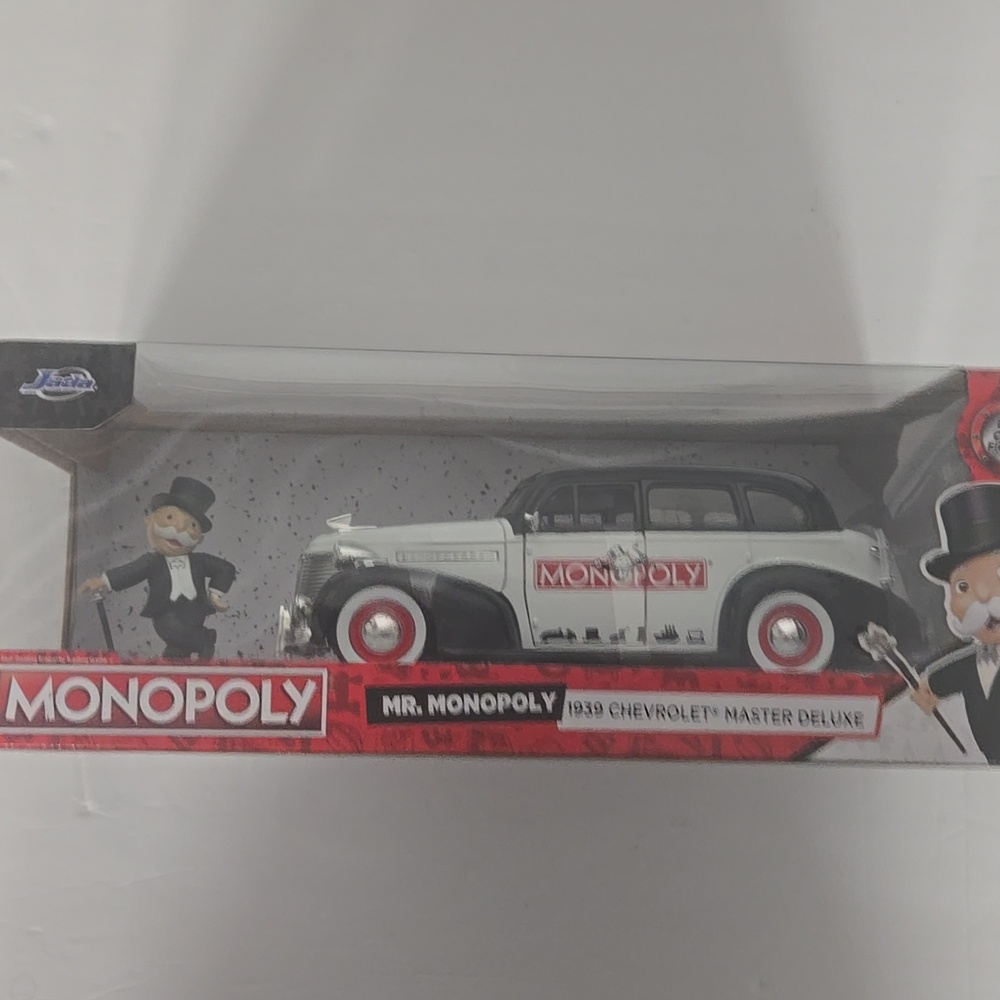 Does Have Slight Damage To Box As Show.ln Monopoly Collectible Car with Figure